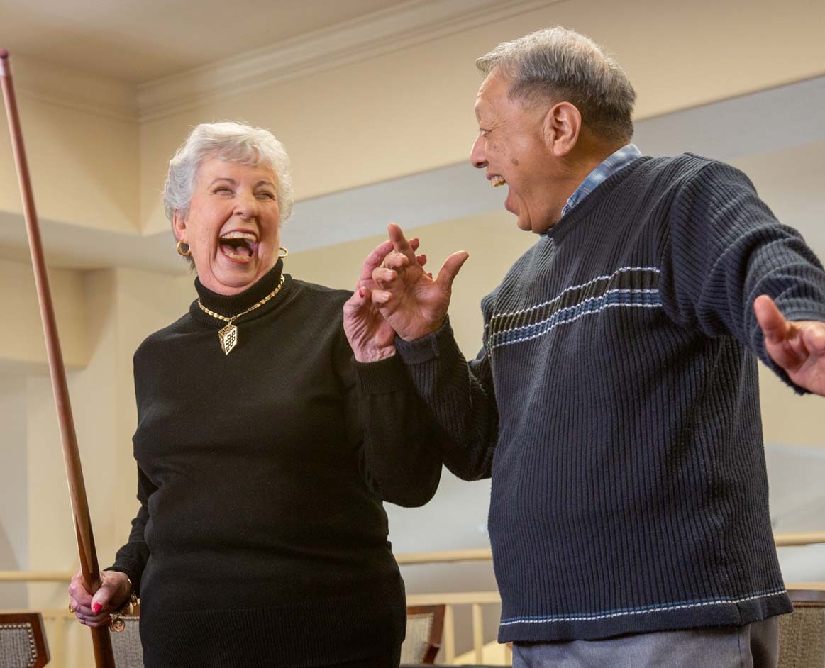 Riverwalk Estates seniors playing billiards