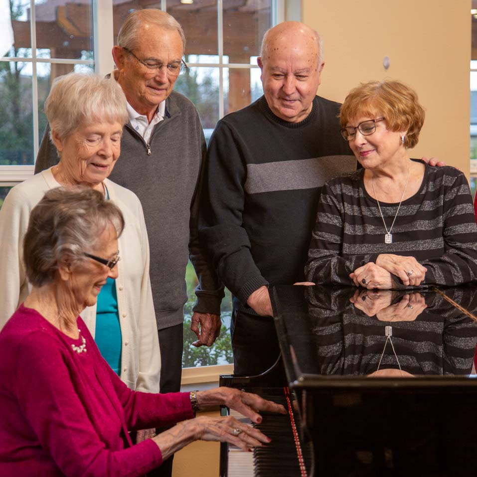 Riverwalk Estates seniors playing piano